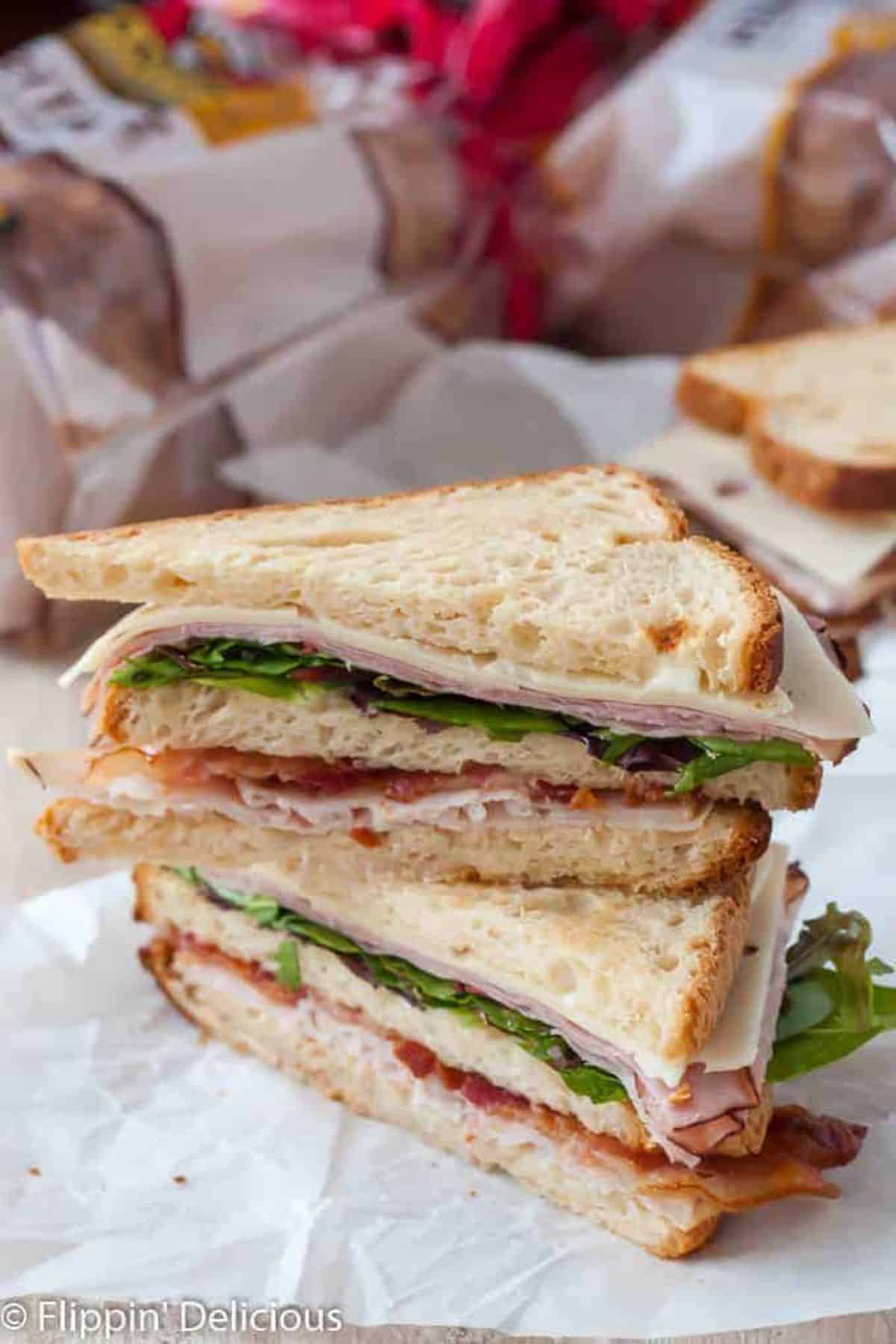 Healthy Gluten-Free Club Sandwich on a table.
