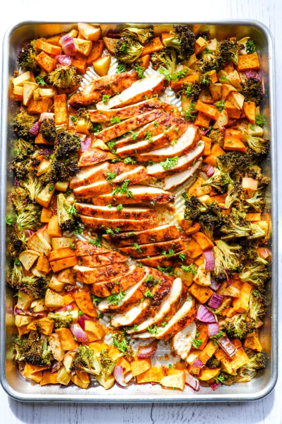 Mouth-watering Sheet Pan Chicken and Sweet Potatoes with Apples and Broccoli.