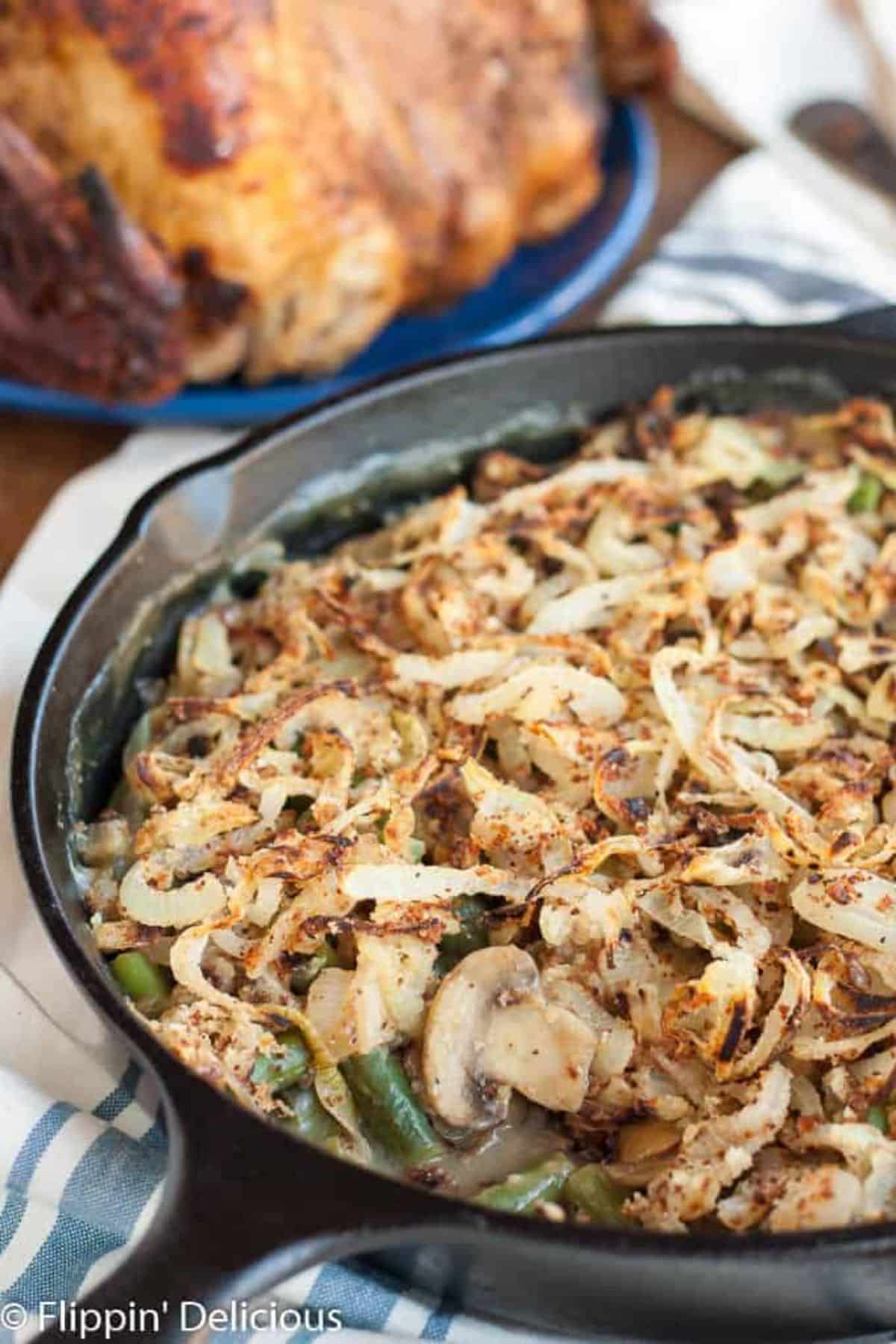 Crispy Gluten-Free Vegan Green Bean on a black skillet.