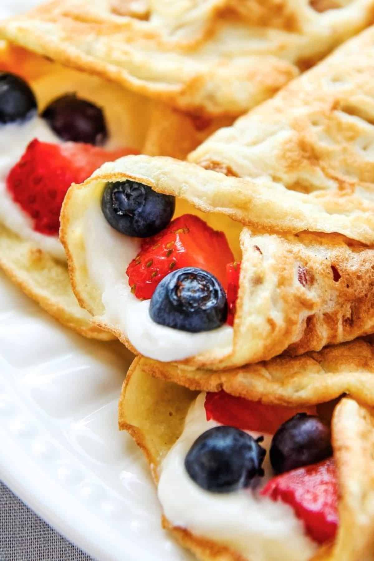 Mouth-watering Coconut Flour Crepes on a white plate.