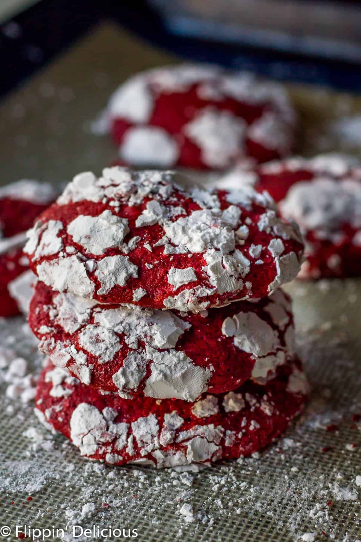 A pile of crispy Red Velvet Crinkle Cookies.
