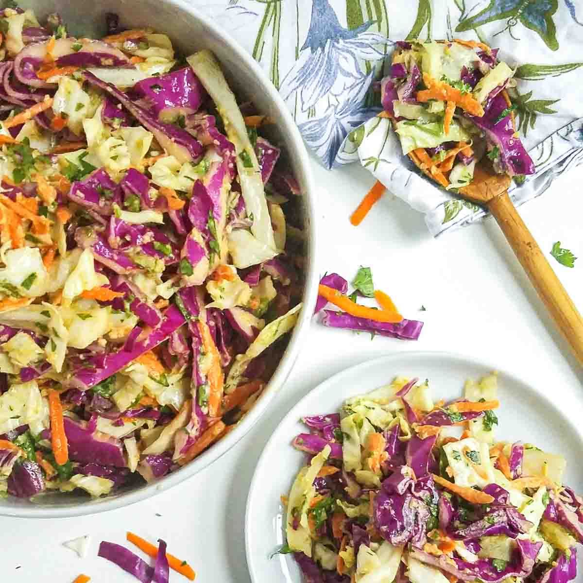 Scrumptious gluten-free Spicy Coleslaw with Avocado Dressing in a bowl and on a plate.