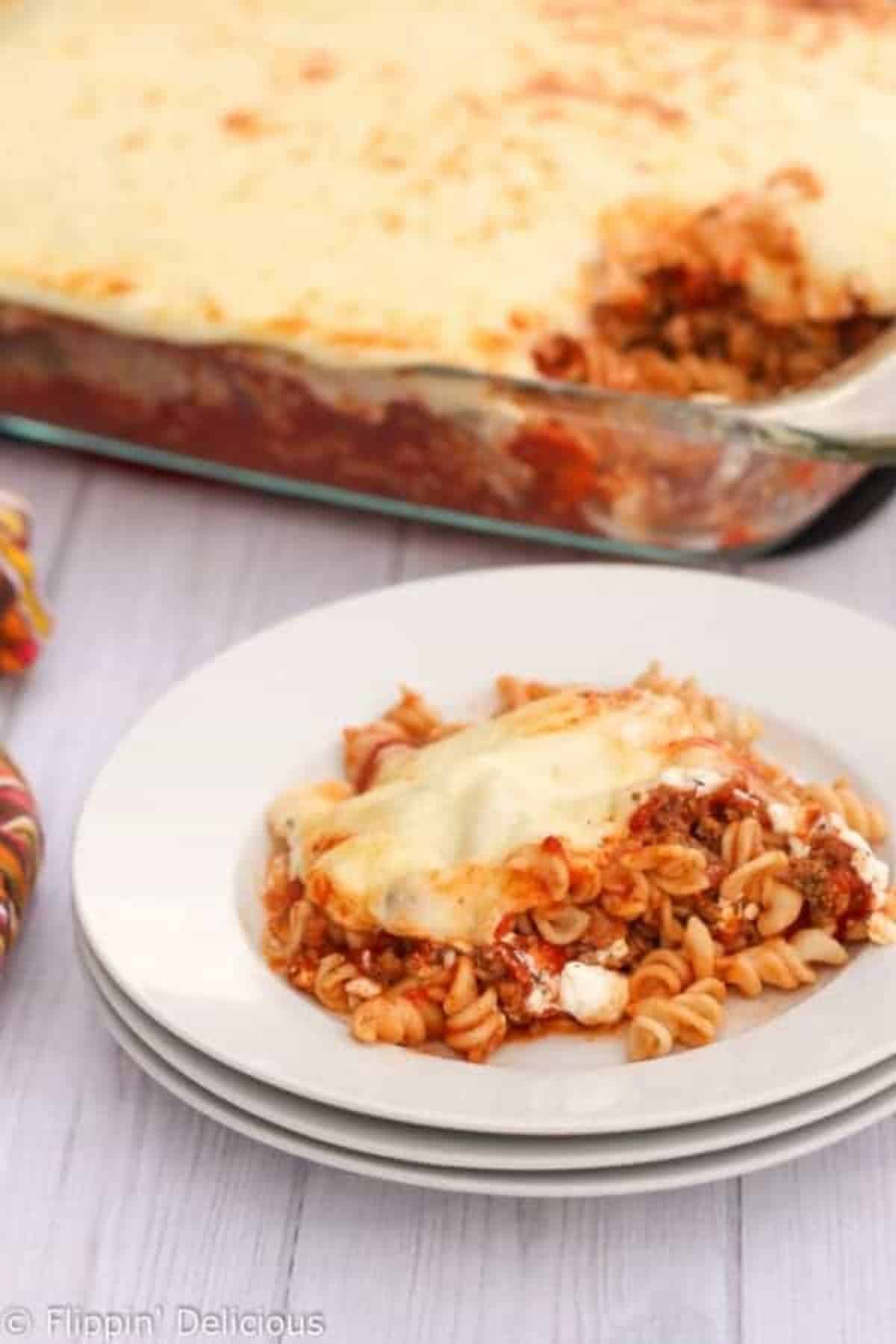 A piece of Easy Gluten-Free Lasagna on a white plate.