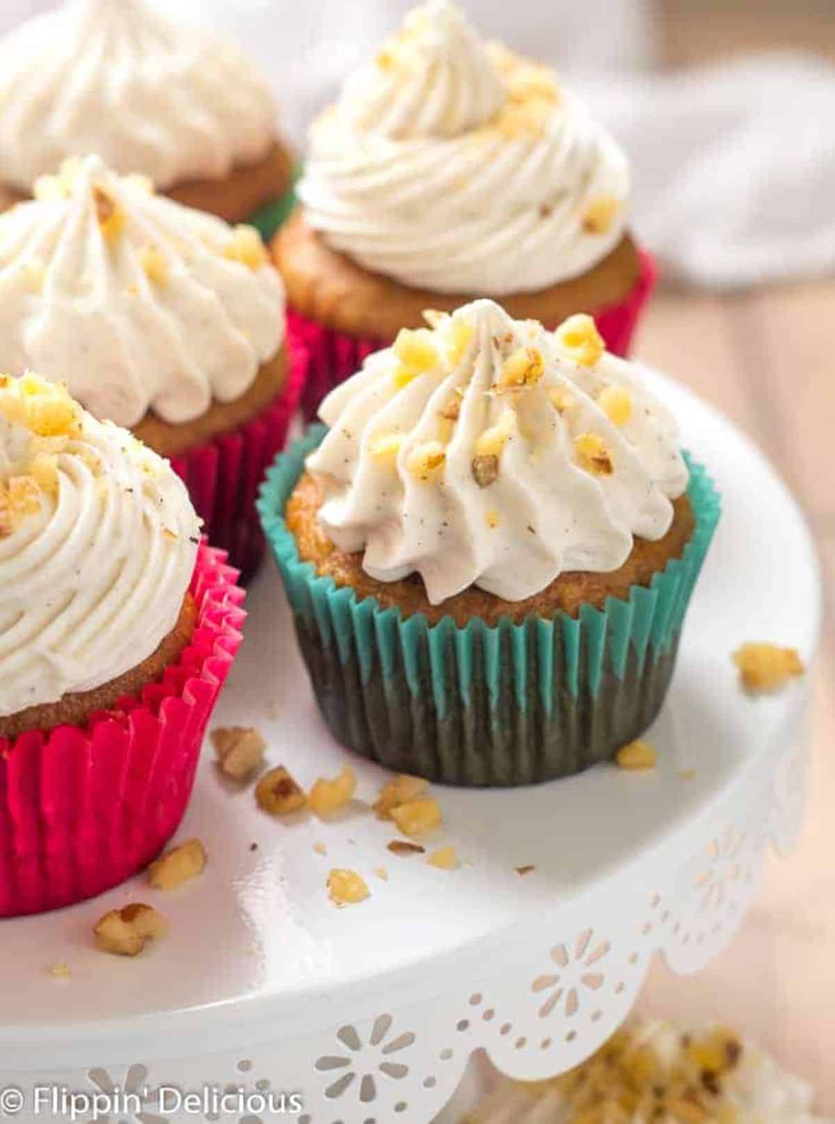 Delicious Gluten-Free Carrot Cake Cupcakes on a cake tray.