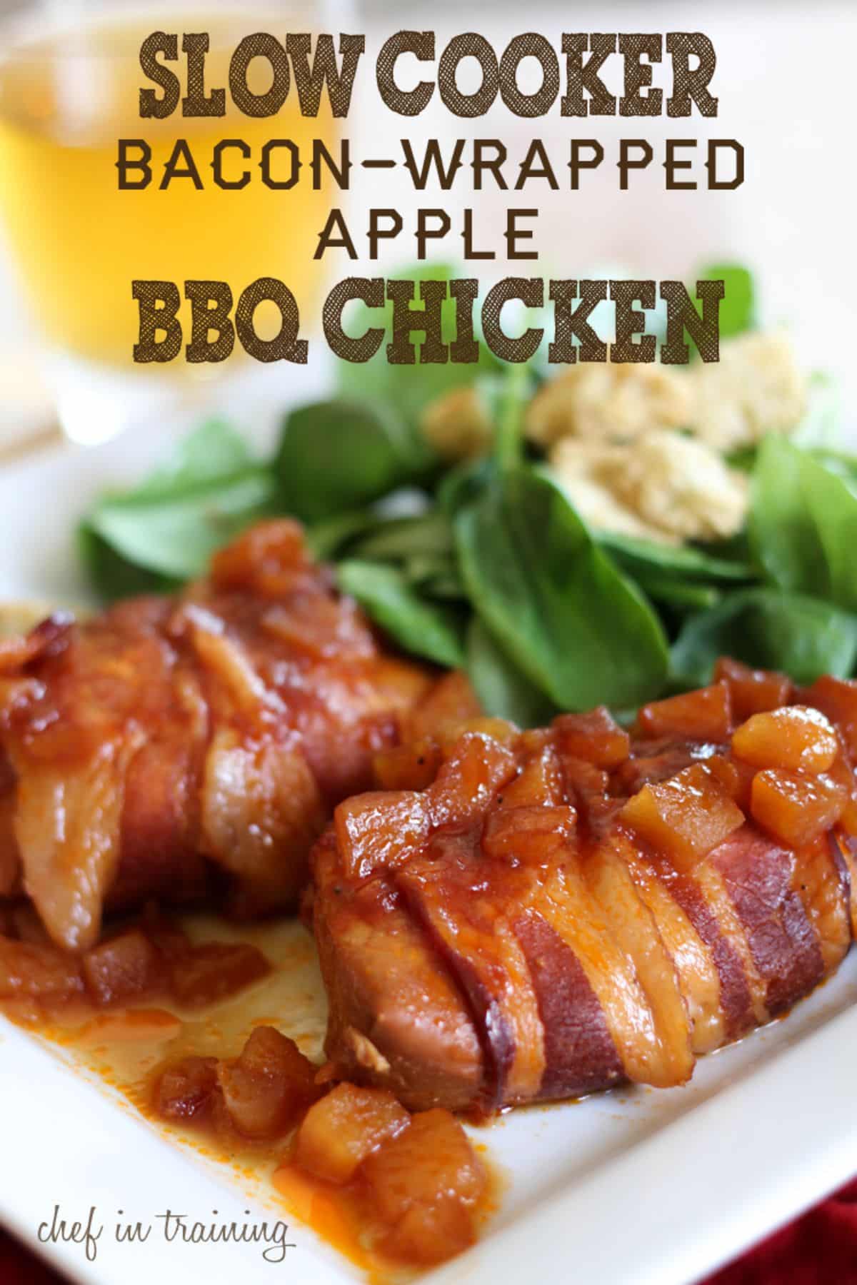 Juicy Slow Cooker Bacon-Wrapped Apple BBQ Chicken on a white plate.