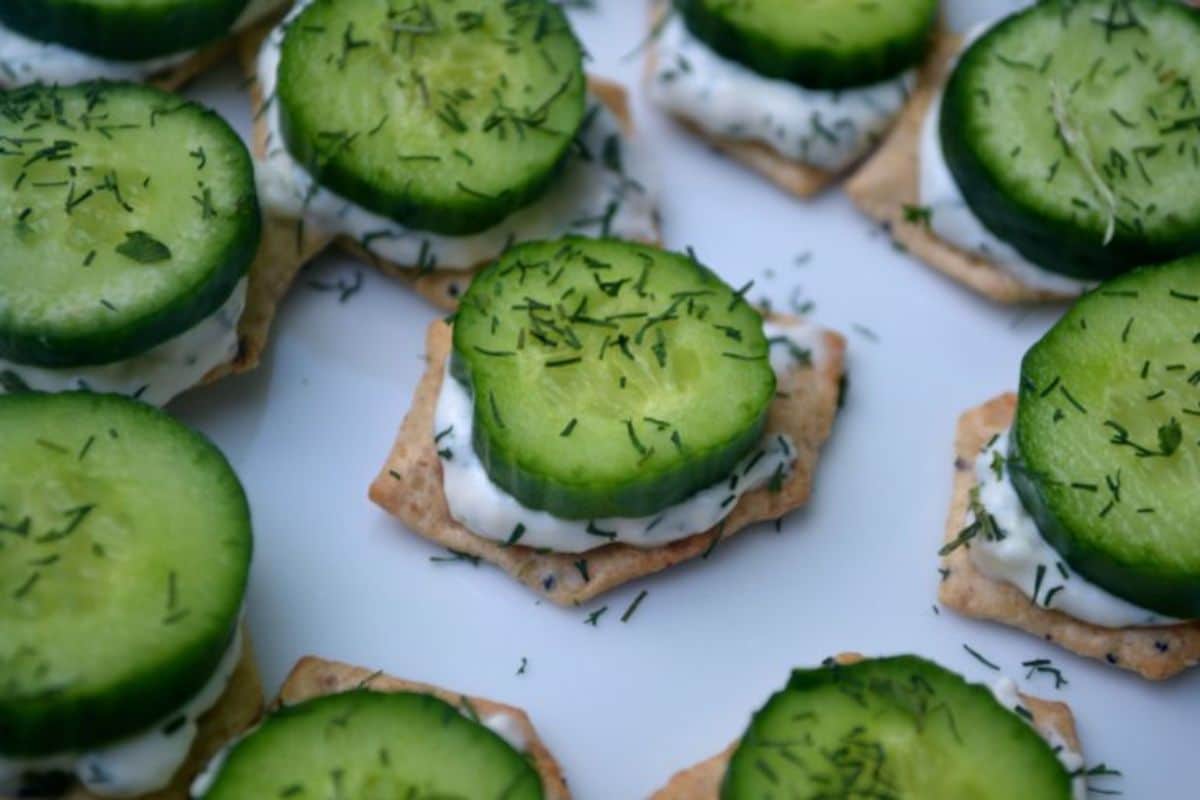 Scrumptious Gluten-Free Cucumber Sandwich Bites on a white tray.