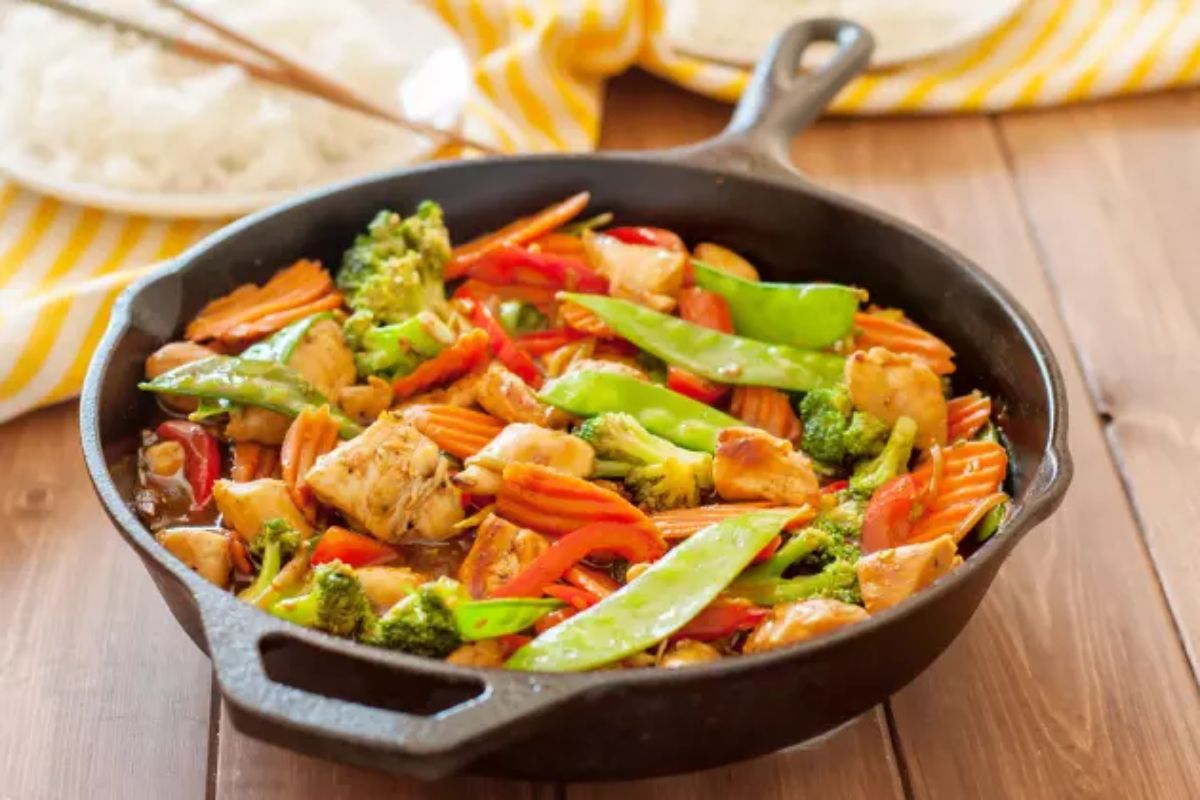 Healthy Gluten-Free Stir Fry on a black skillet.