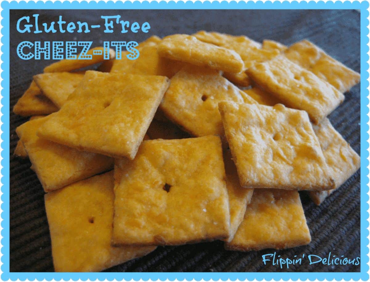 A pile of crispy Gluten-Free Cheez-Its on a table.