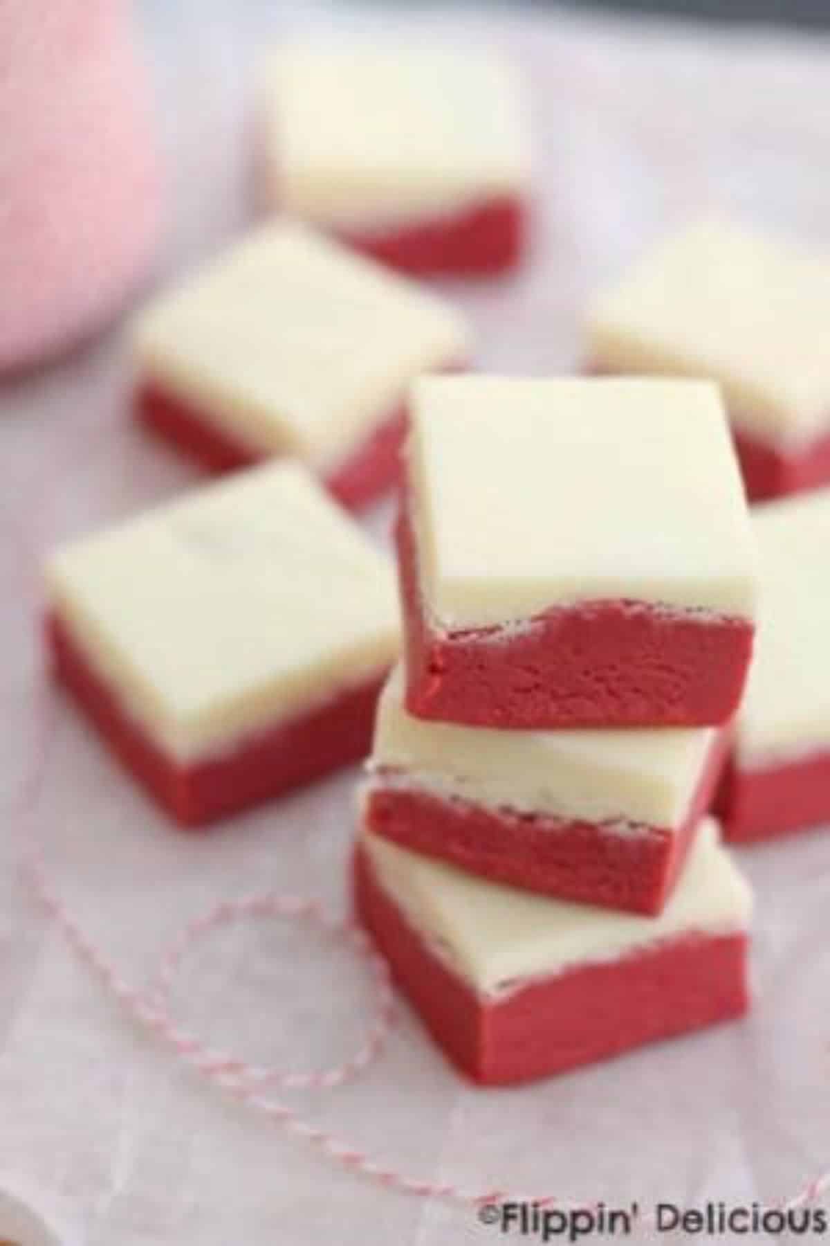 A pile of Red Velvet Fudges on a table.