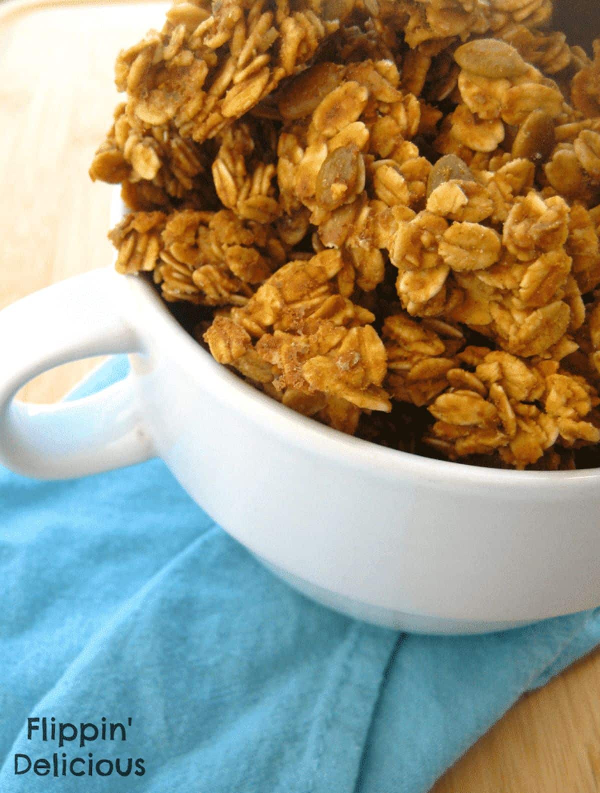Cripsy Salted Caramel Granola in a white cup.