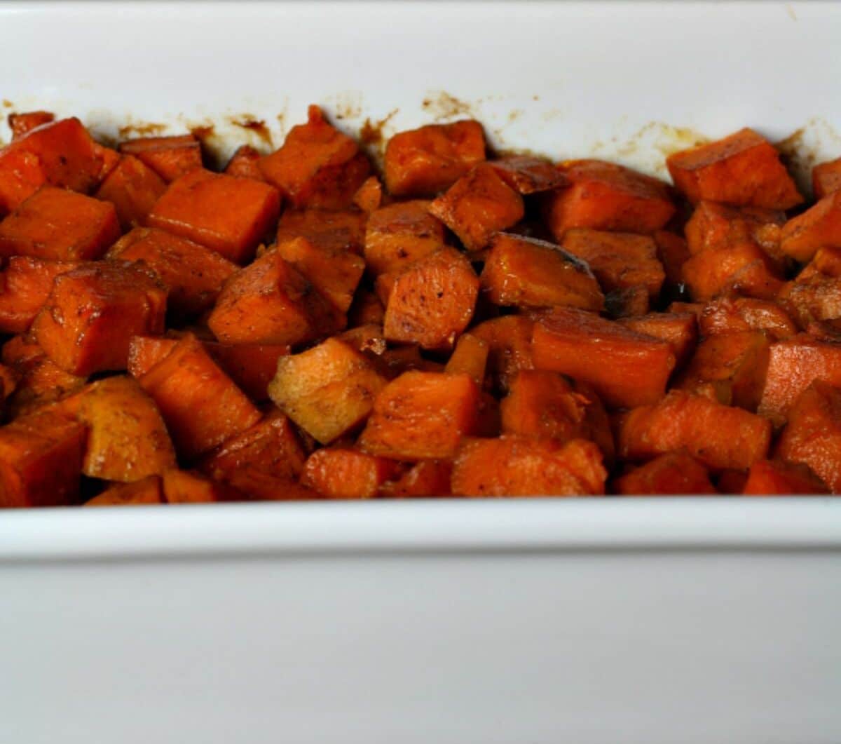 Gluten-free Glazed Sweet Potatoes om a white casserole.