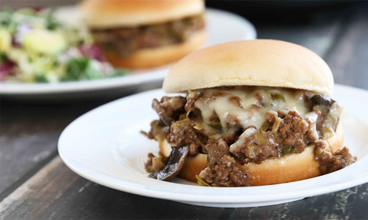 Tasty Instant Pot Philly Cheesesteak Sloppy Joe's on a white plate.