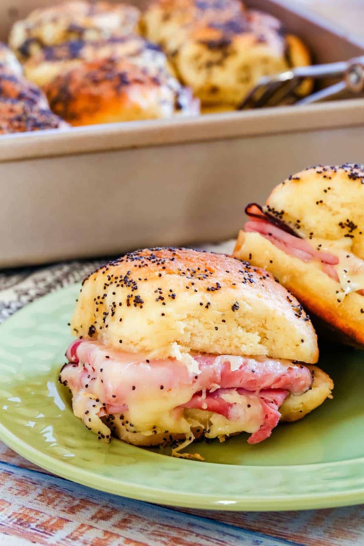 Scrumptious Ham and Cheese Sliders on a green plate.