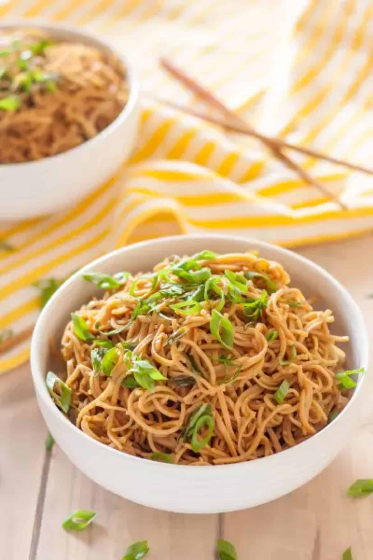 Healthy Gluten-Free Sticky Garlic Noodles in a white bowl.