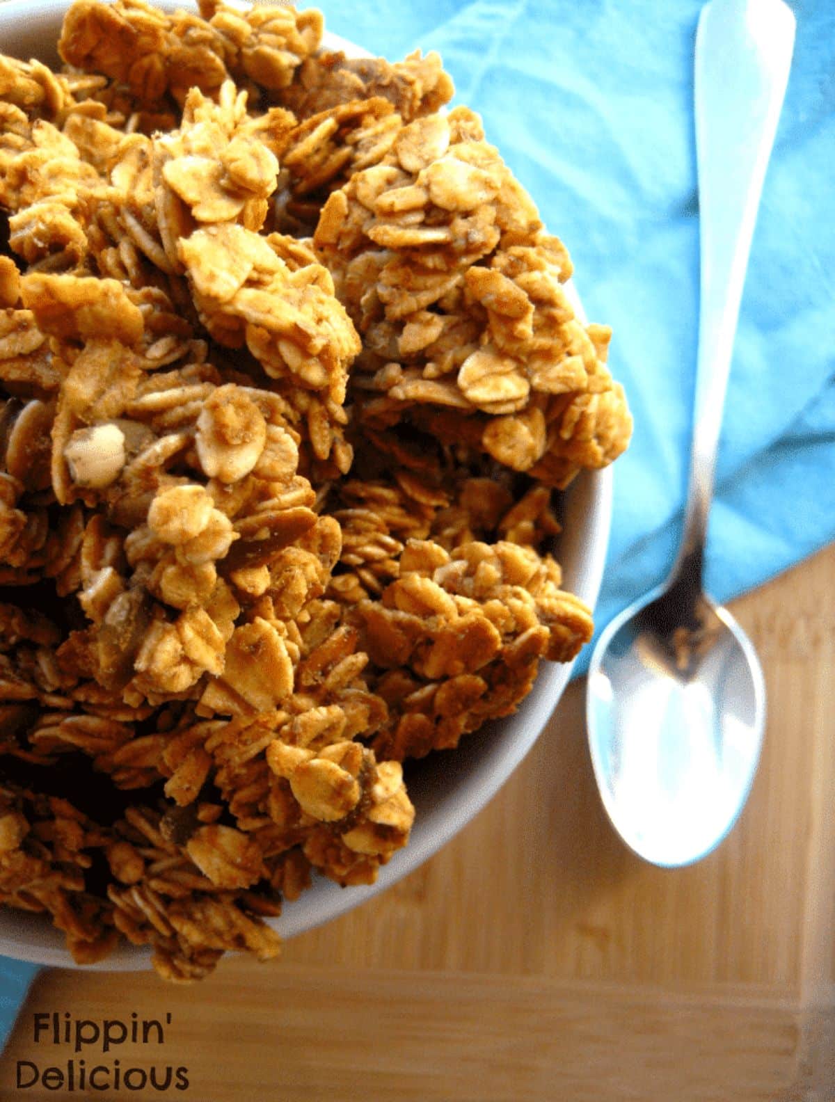 Crunchy Salted Caramel Granola in a white bowl.