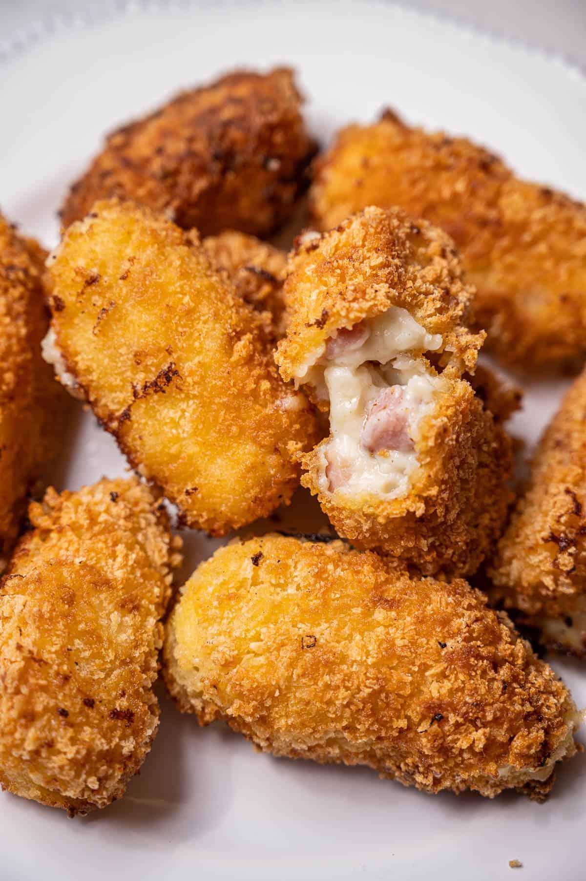 Crunchy Spanish Ham Croquetas on a white plate.