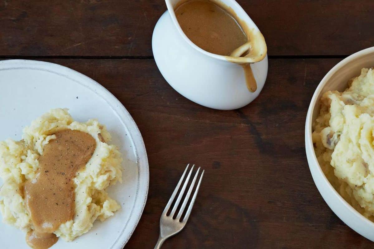 Delicious Vegan and Gluten-Free Gravy in a white bowl and on various of dishes.