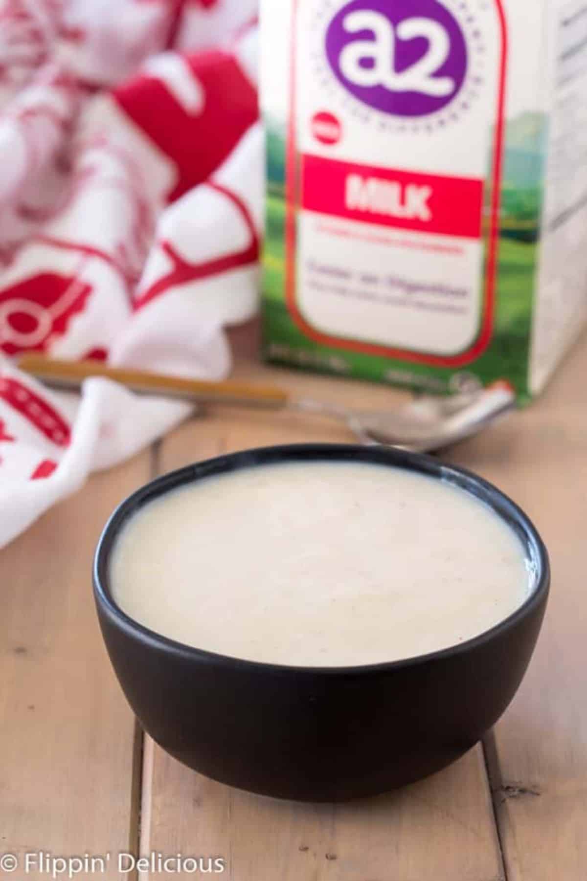 FLavorful Gluten-Free Pudding in a black bowl.