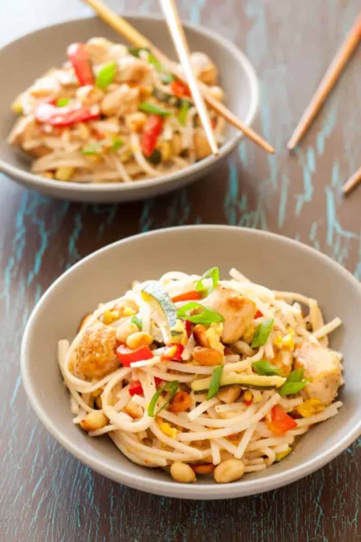 Delicious Gluten-Free Pad Thai in two gray bowls.