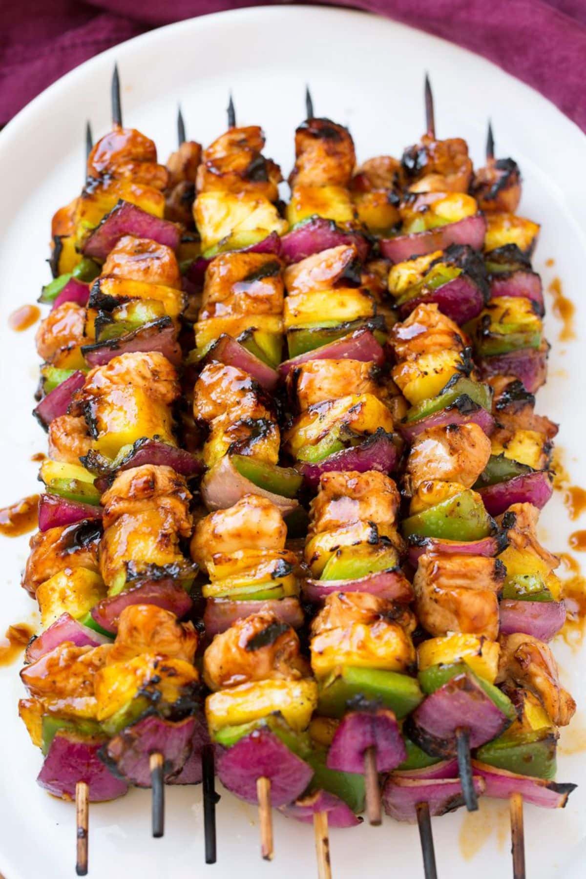 Scrumptious Hawaiian Chicken Kebabs on a white tray.