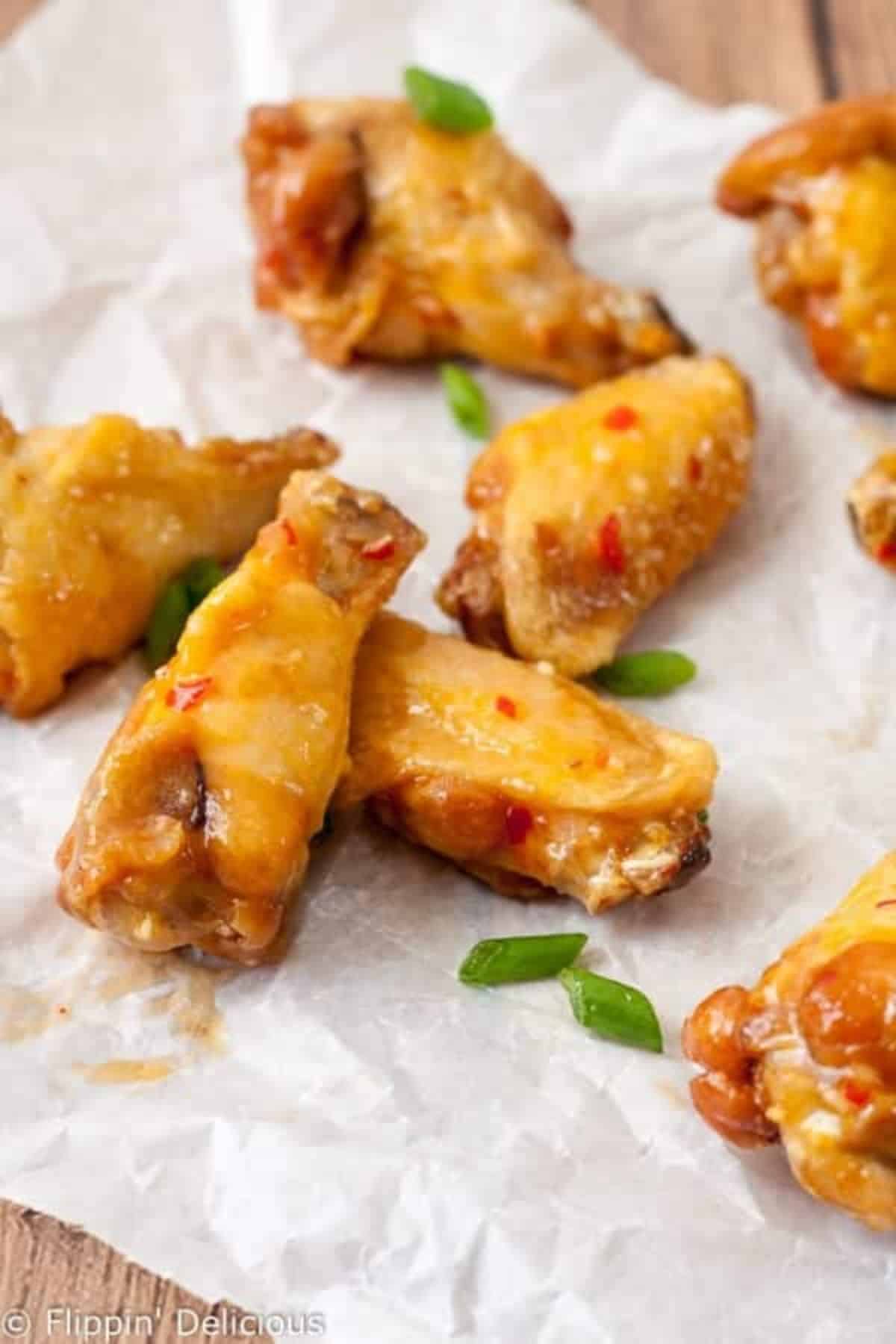 Delicious gluten-free Sweet Chili Wings on a table.
