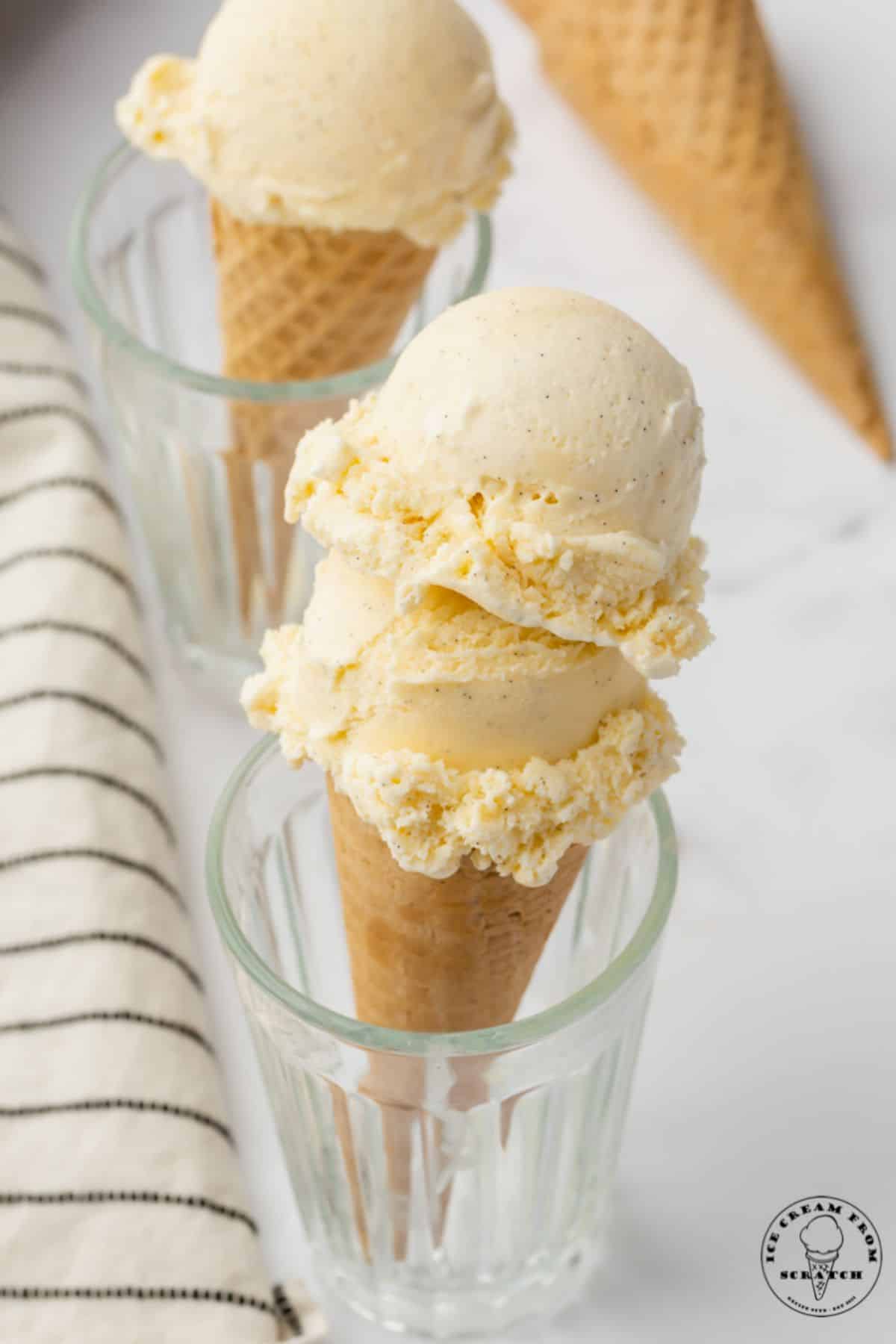 Tasty Yolk-Based Vanilla Ice Cream on two cones.