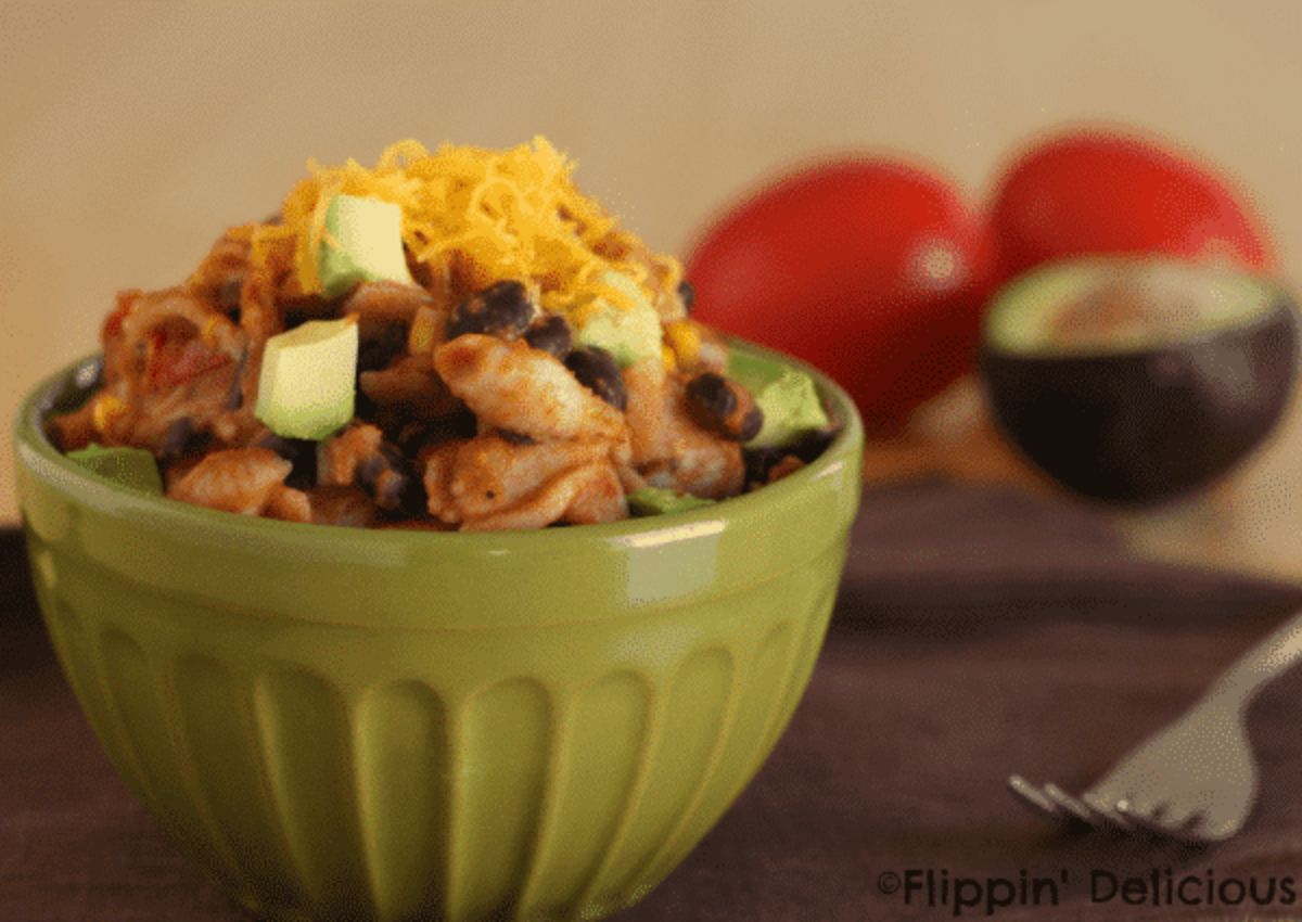 Tasty Gluten-Free One-Pot Chicken Taco Pasta in a green bowl.