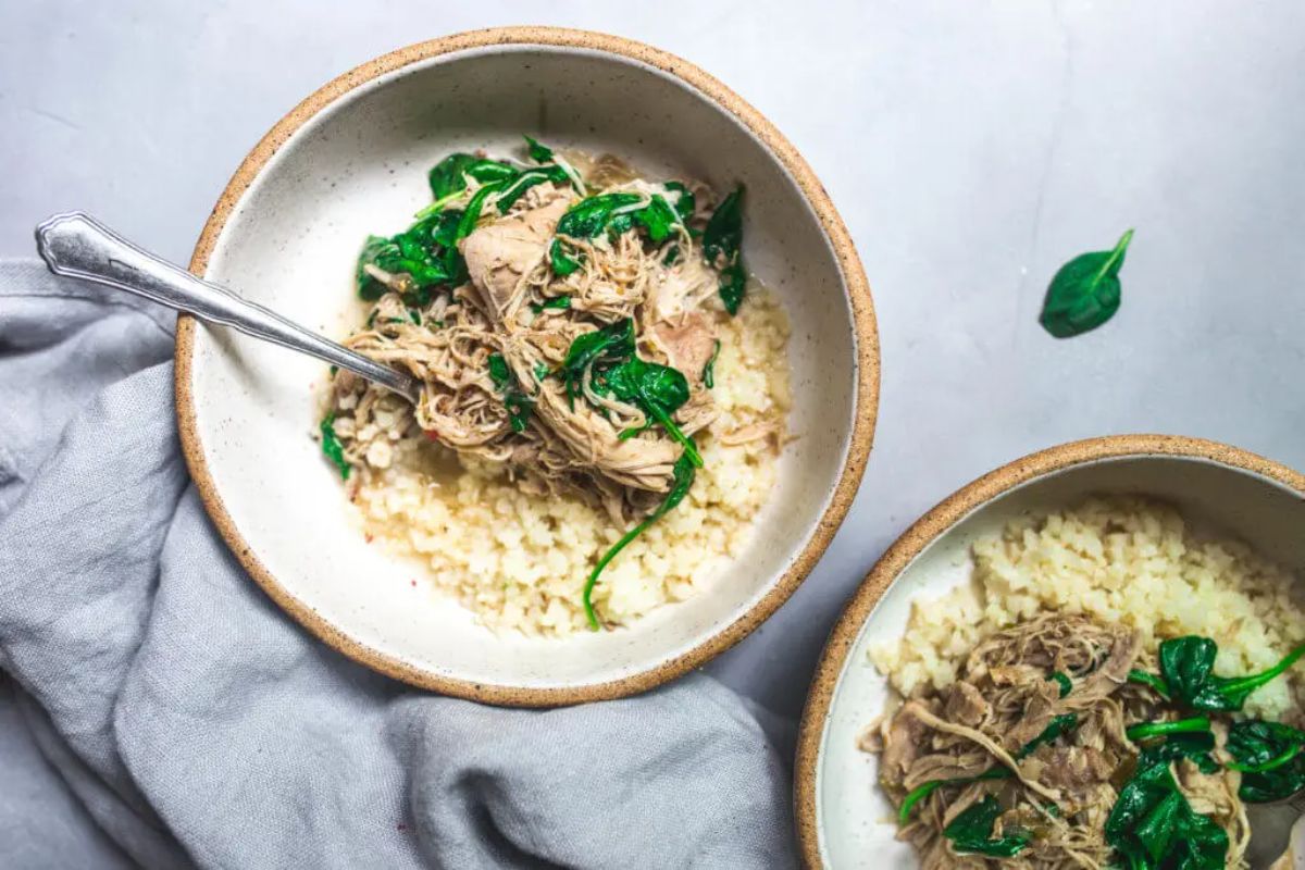 Flavorful nstant Pot Chicken Chile Verde in a bowl with a fork.