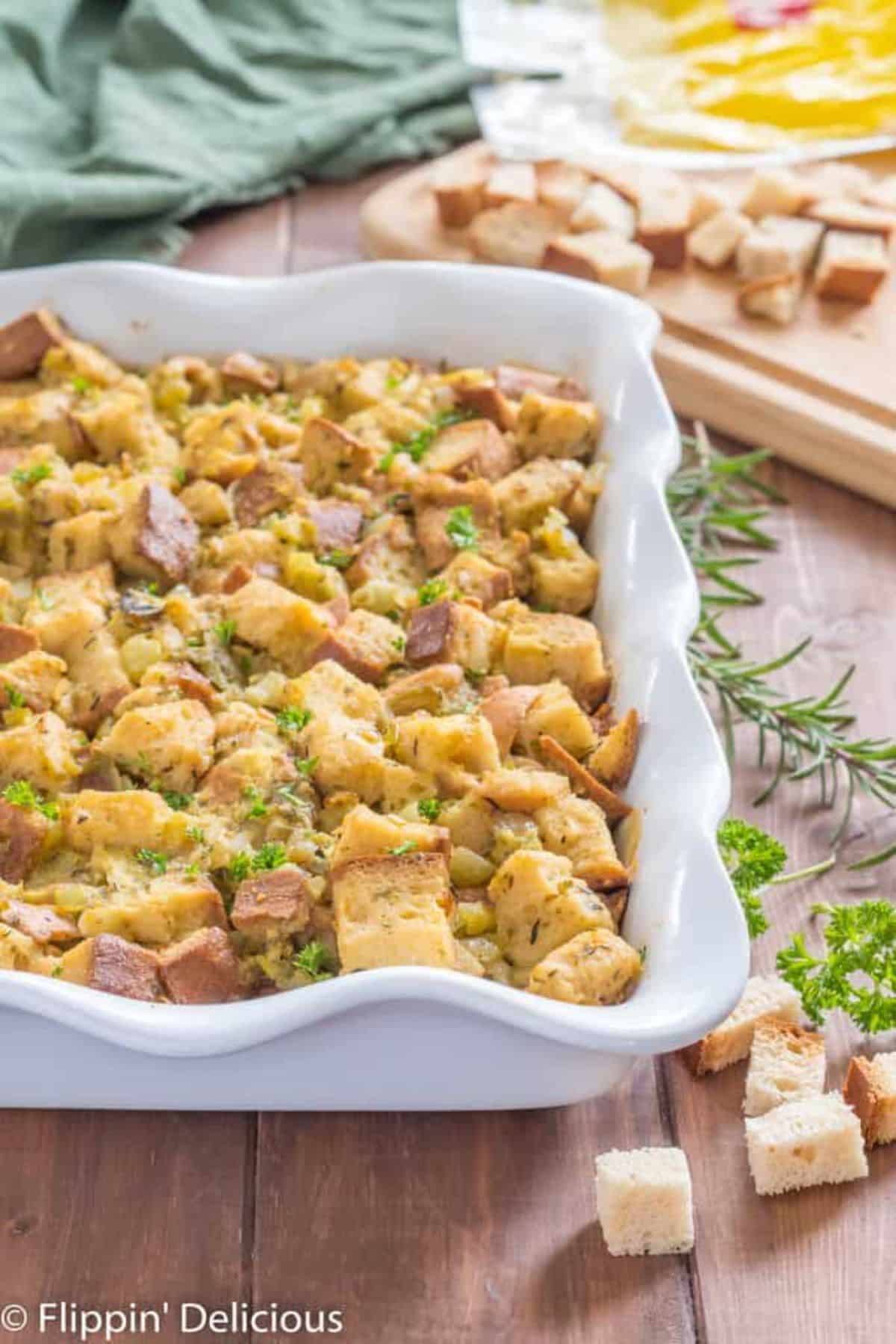 Scrumptious Gluten-Free Stuffing With Green Chile in a white casserole.