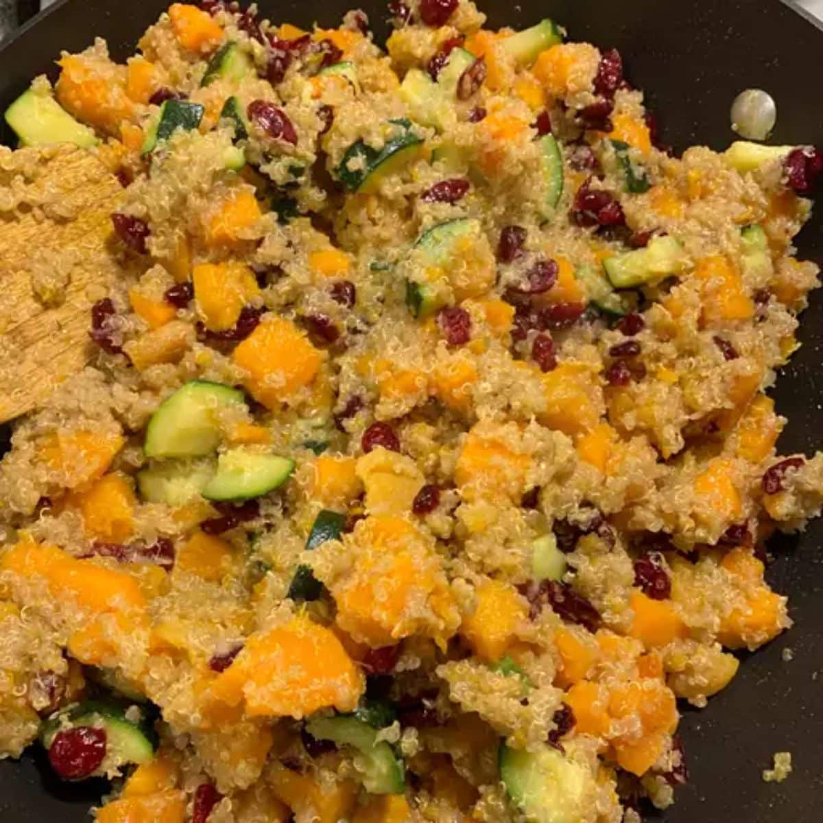 Tasty Quinoa Stuffing in a black skillet.