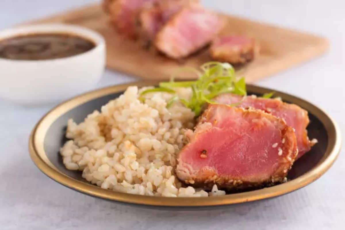Delicious Seared Ahi Tuna Steaks with rice on a plate.