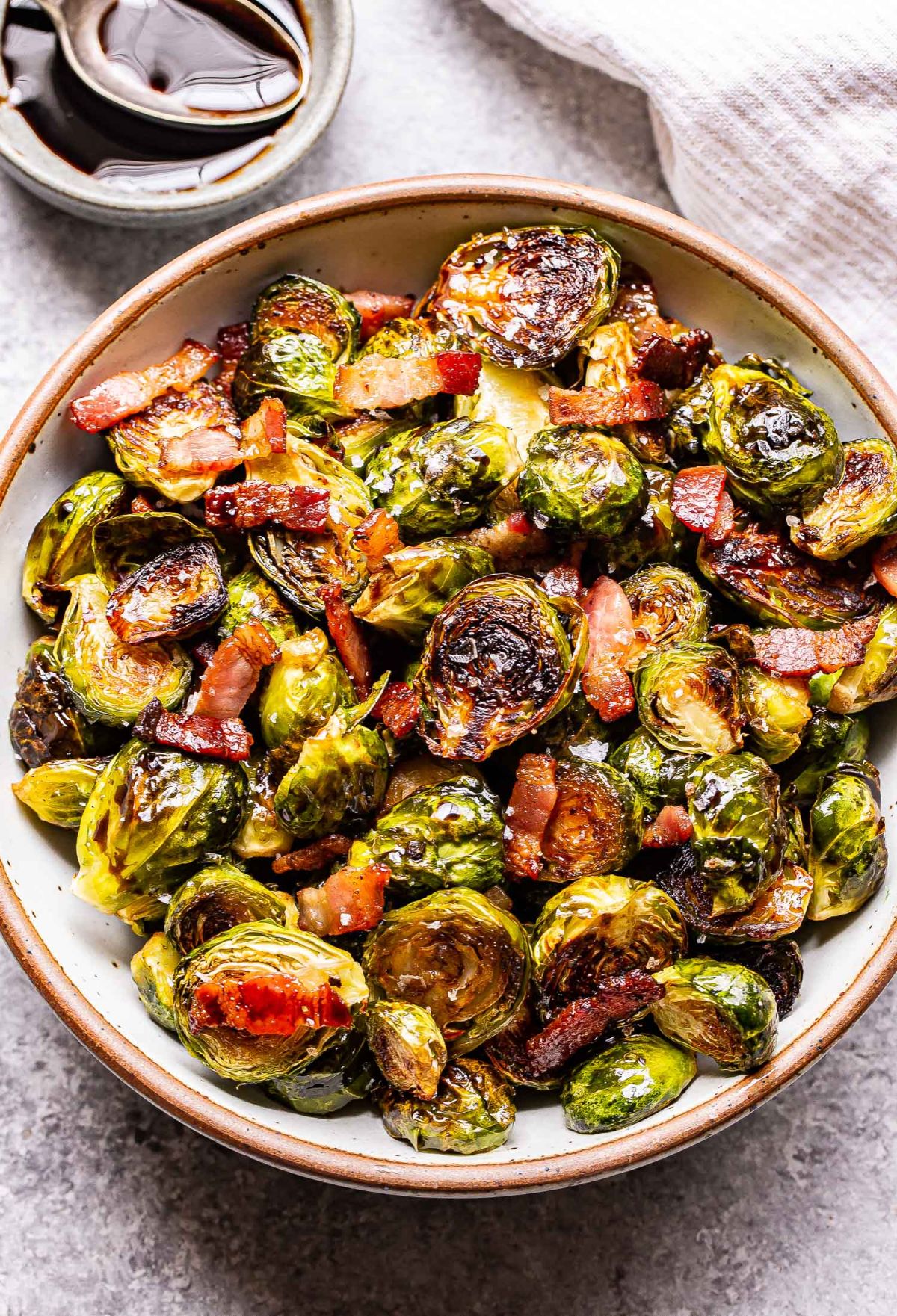 Crunchy Balsamic Maple Roasted Brussels Sprouts with Bacon in a bowl.