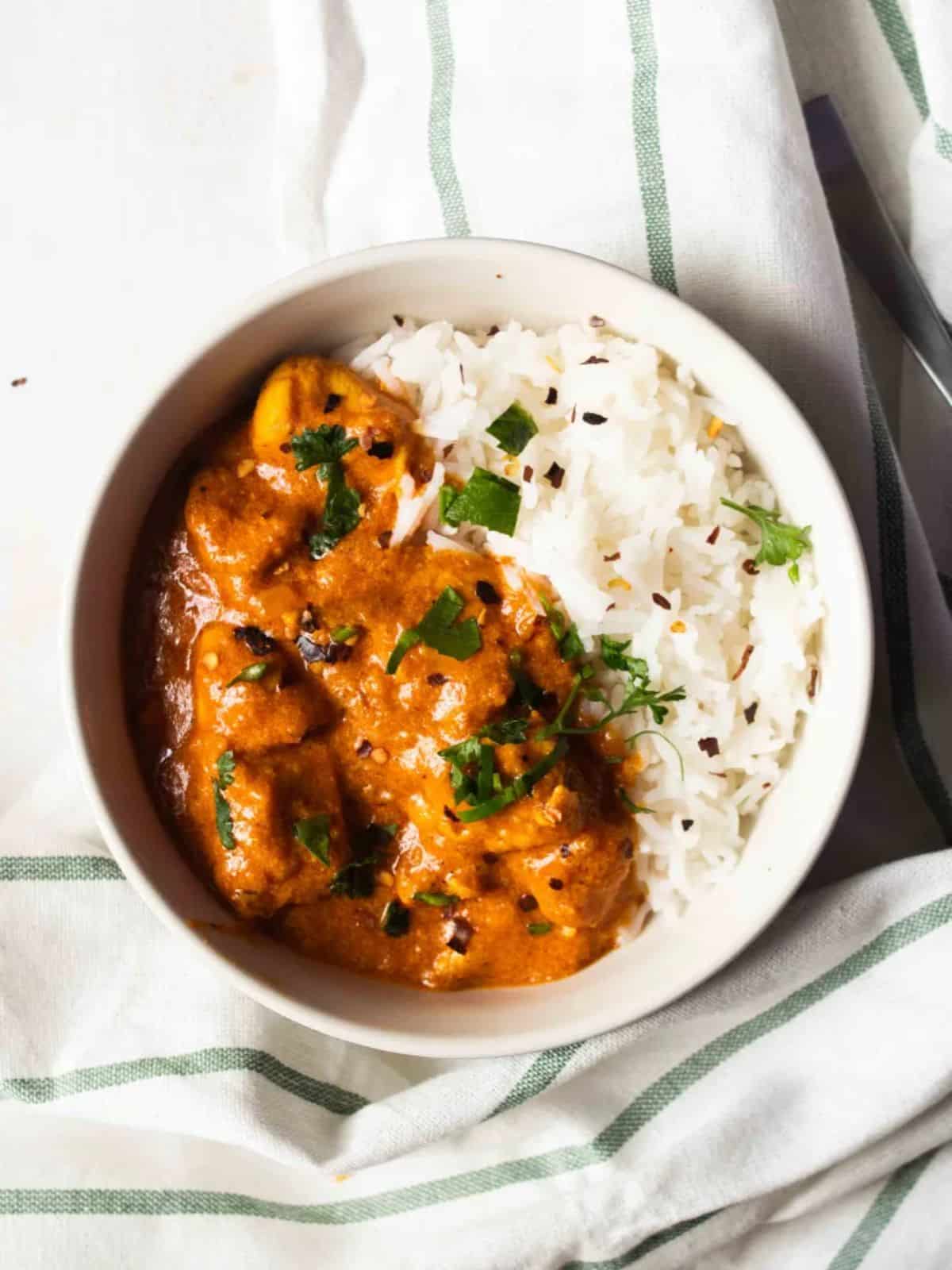 Creamy Easy Gluten-Free Butter Chicken in a white bowl.