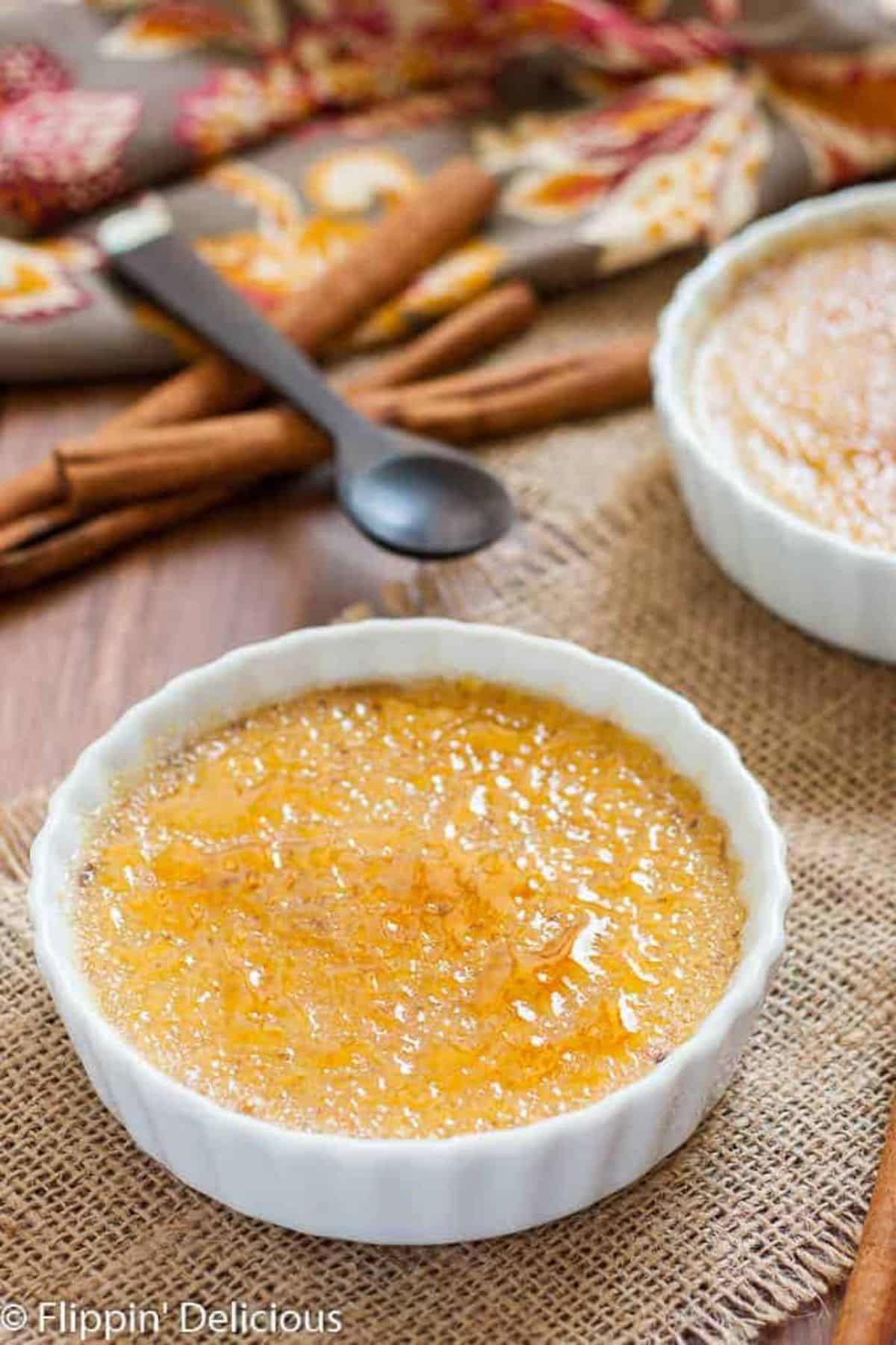 Flavorful Dairy-Free Pumpkin Creme Brulee on a white bowl.