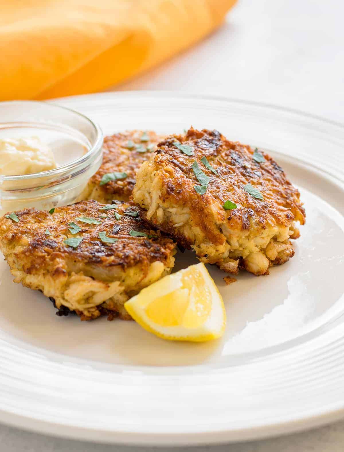 Scrumptious Gluten-Free Crab Cakes on a white plate.
