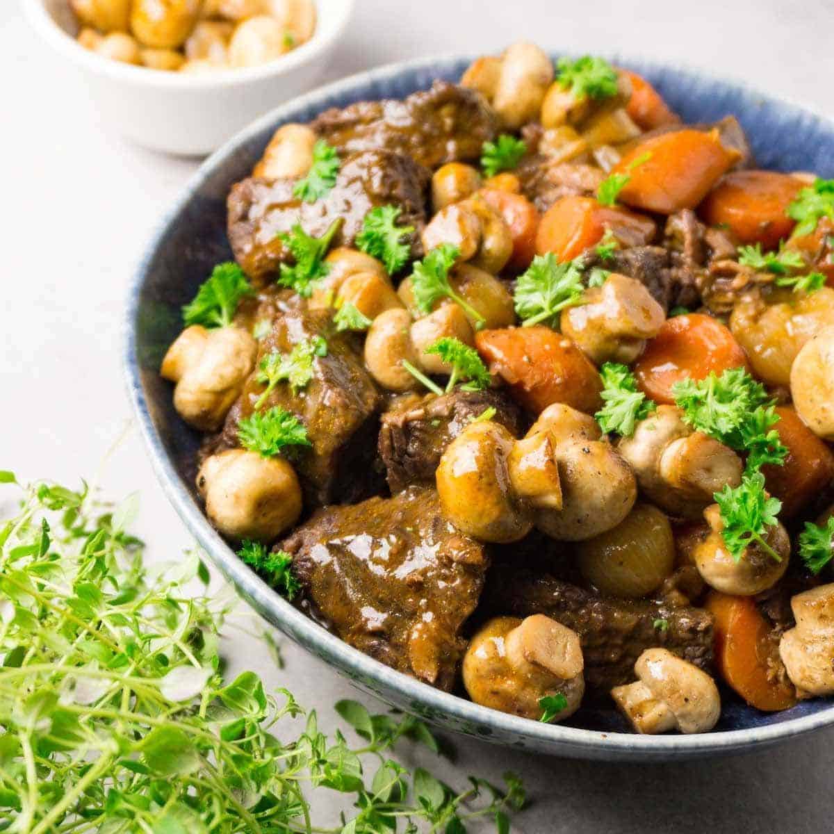 Delicious gluten-free Easy Beef Bourguignon on a blue bowl.