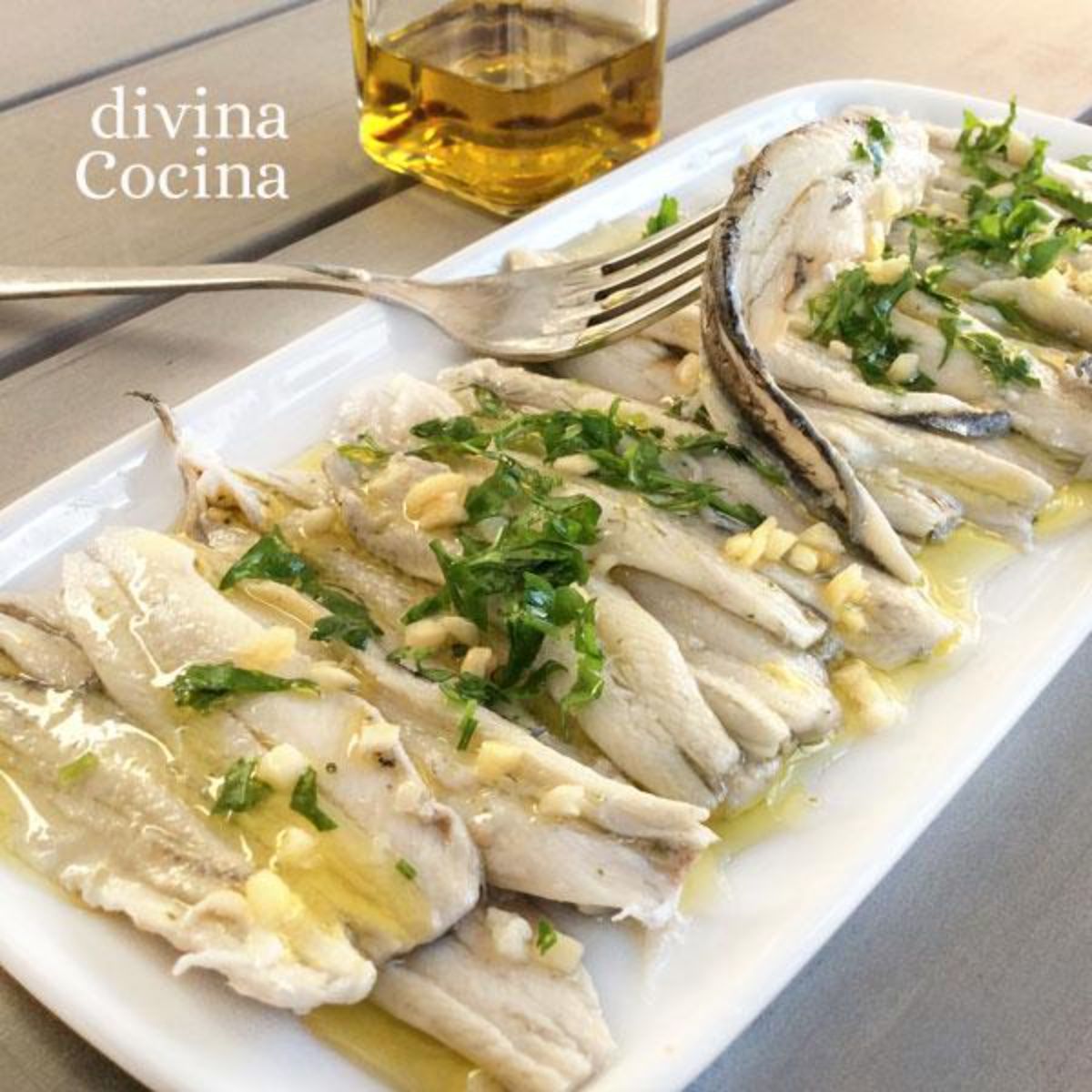 Tasty Boquerones en Vinagre on a white tray.